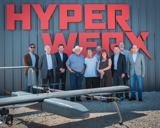 Rep. Carter, Mayor Condon, Florence Chamber of Commerce President Peggy Morse, and Chamber member Ben Daniel posing outside HyperWerx facility with SparkCognition's X2 UAV displayed.